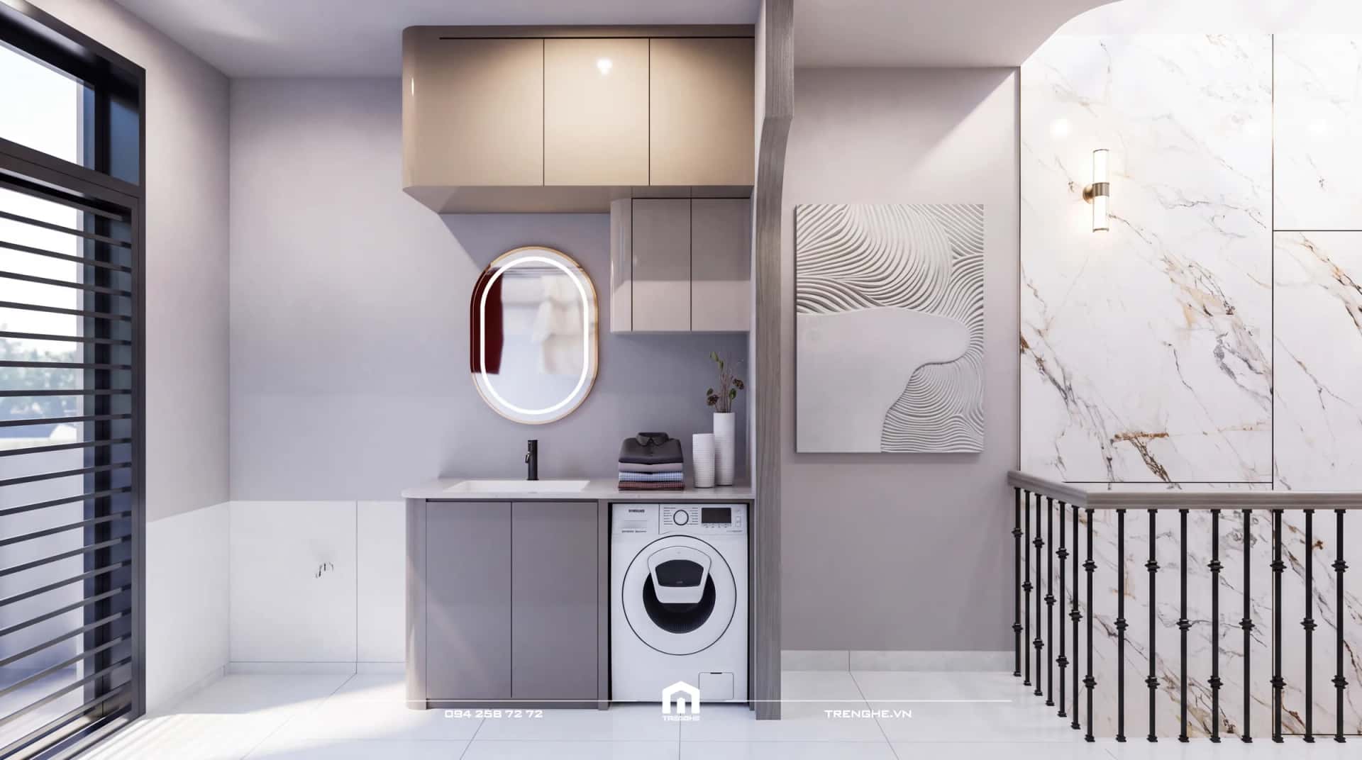 Khu giặt V’ House với máy giặt, chậu rửa, gương viền đèn và lan can cầu thang