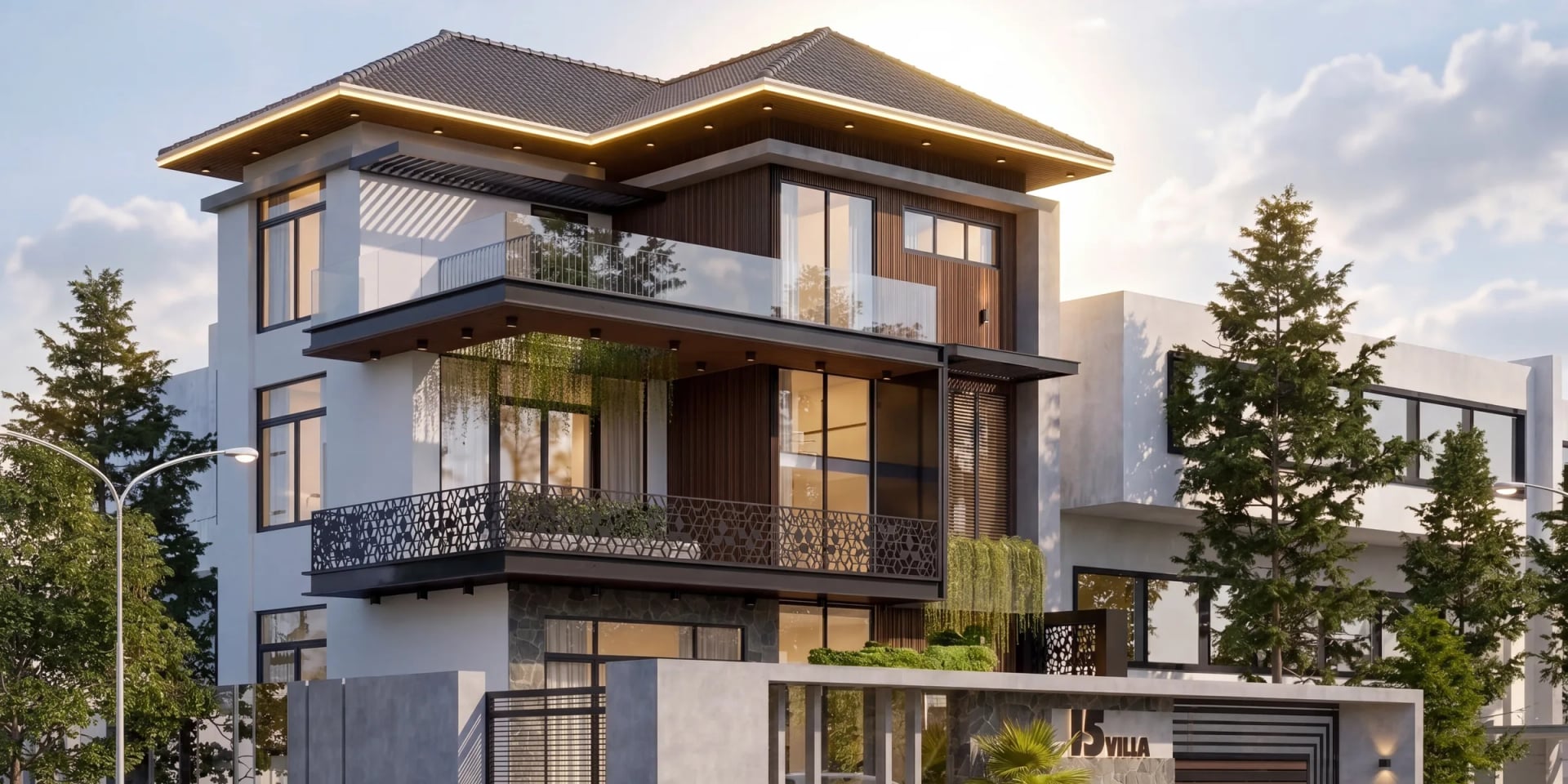 Biệt thự mái Nhật 3 tầng B’ Villa Long Hải ban ngày: khối nhà trắng ốp lam gỗ, dải LED viền mái, lan can kính và sắt hoa văn