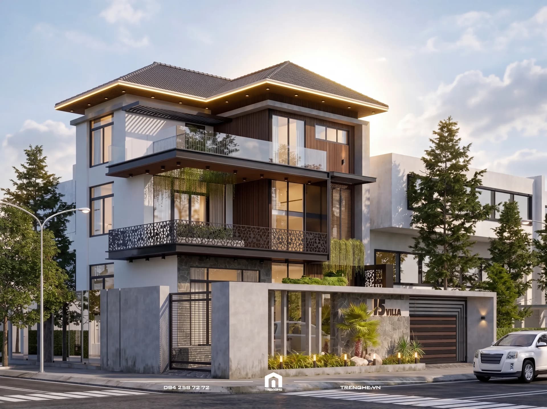 Biệt thự B’ Villa Long Hải nhìn từ góc đường ban ngày, dải đèn LED viền mái Nhật, ban công kính và lan can sắt hoa văn