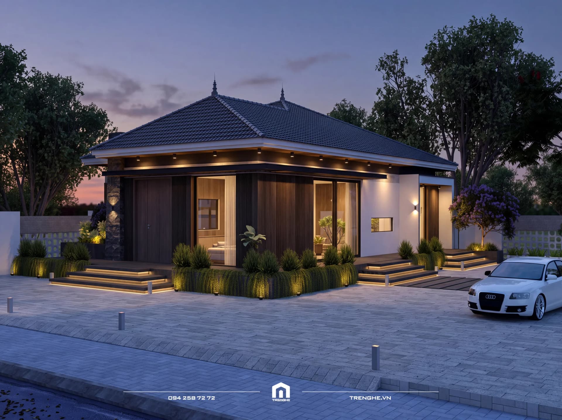 Góc chéo D’ House lúc chạng vạng, dải đèn LED hắt sáng các bậc tam cấp và đèn tường trên mảng tường trắng bên hông