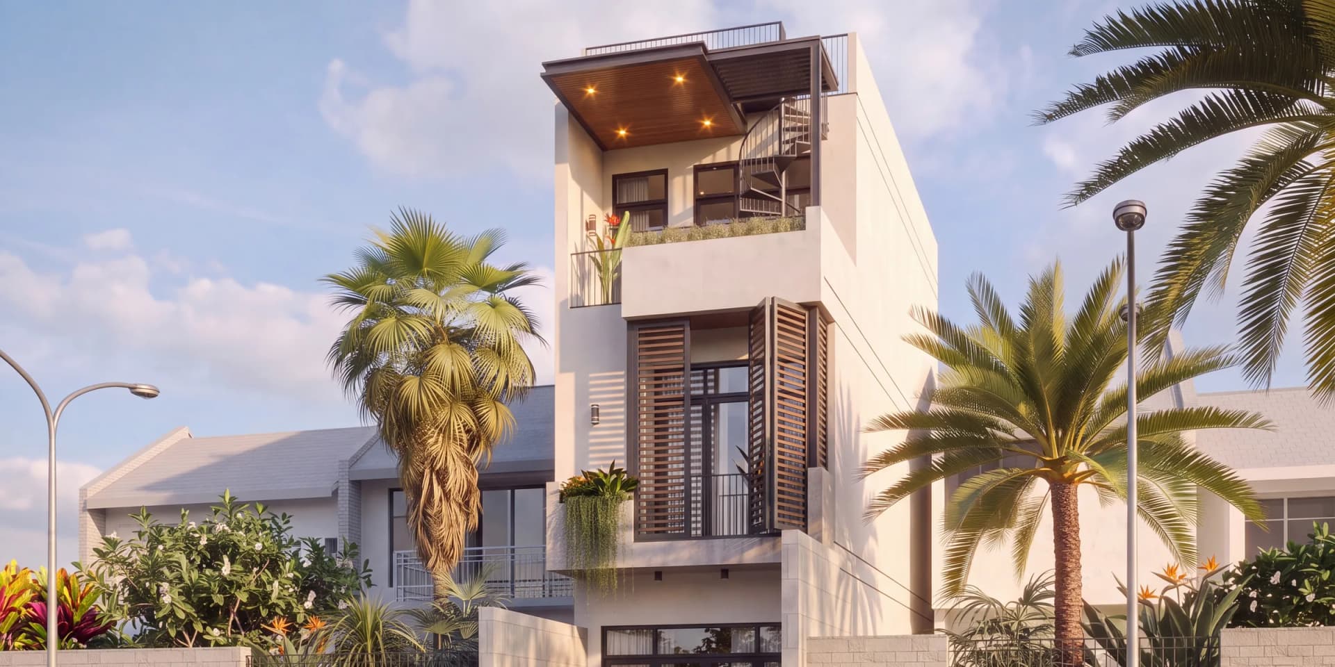 Nhà phố 3 tầng H’ House ở Vũng Tàu dưới nắng vàng: mái gỗ có đèn âm trần, cầu thang xoắn lên sân thượng và cửa lam tầng 2