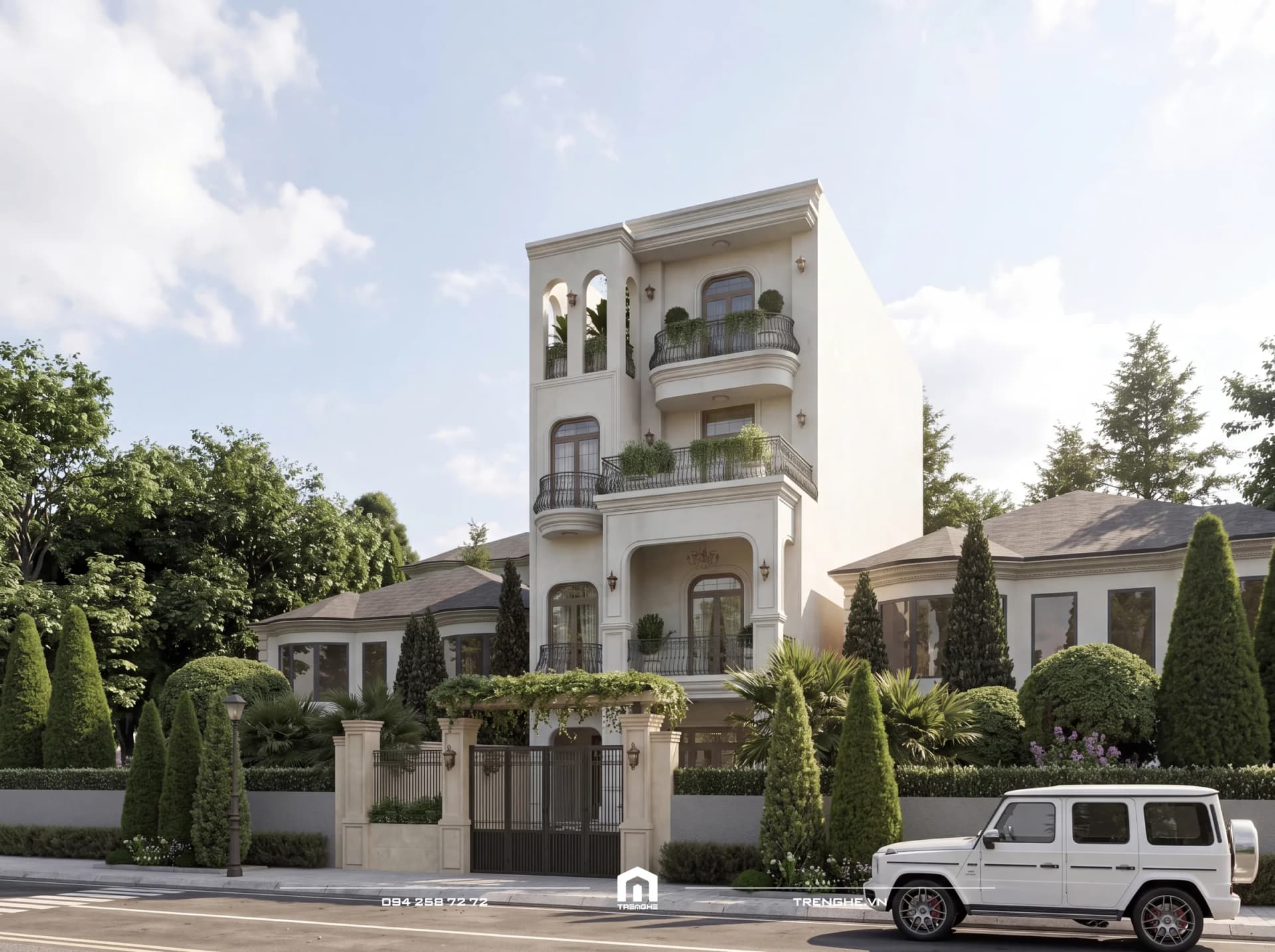 Nhà phố tân cổ điển N’ House 4 tầng ban ngày nhìn góc trái: chuỗi cửa vòm, ban công bán nguyệt lan can sắt, cổng có giàn hoa và hàng tùng trước nhà