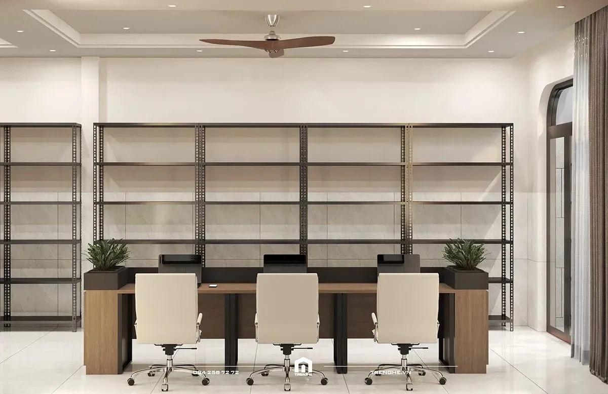 Phòng làm việc chuyên nghiệp tại DH' House với hệ bàn dài tối giản và tủ sách kịch trần